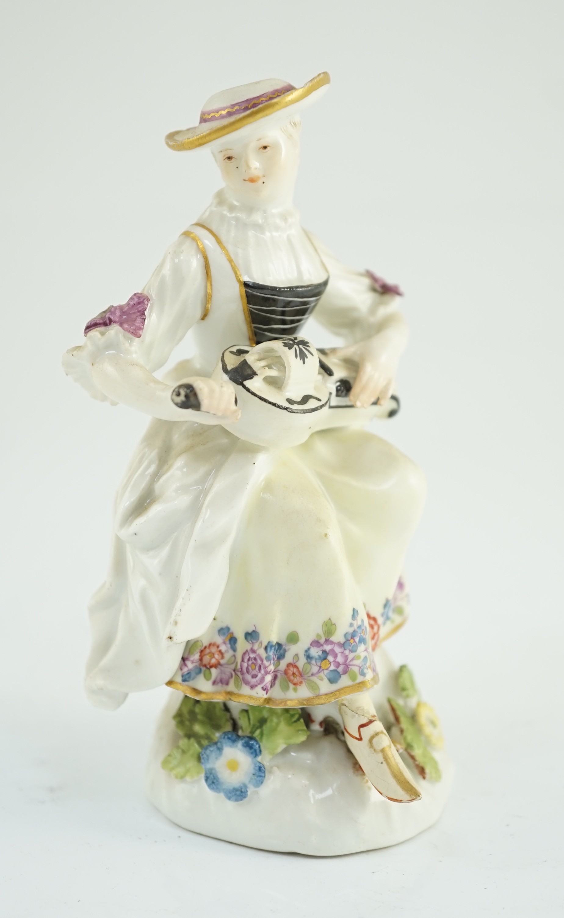 A Meissen porcelain figure of a woman playing the hurdy gurdy, mid 18th century, possibly modelled by J. J. Kandler, 13cm high, restored right foot, Provenance - purchased from Winifred Williams, Eastbourne/London before